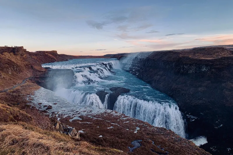 Gullfoss waterfall dropping into a canyon in low evening light